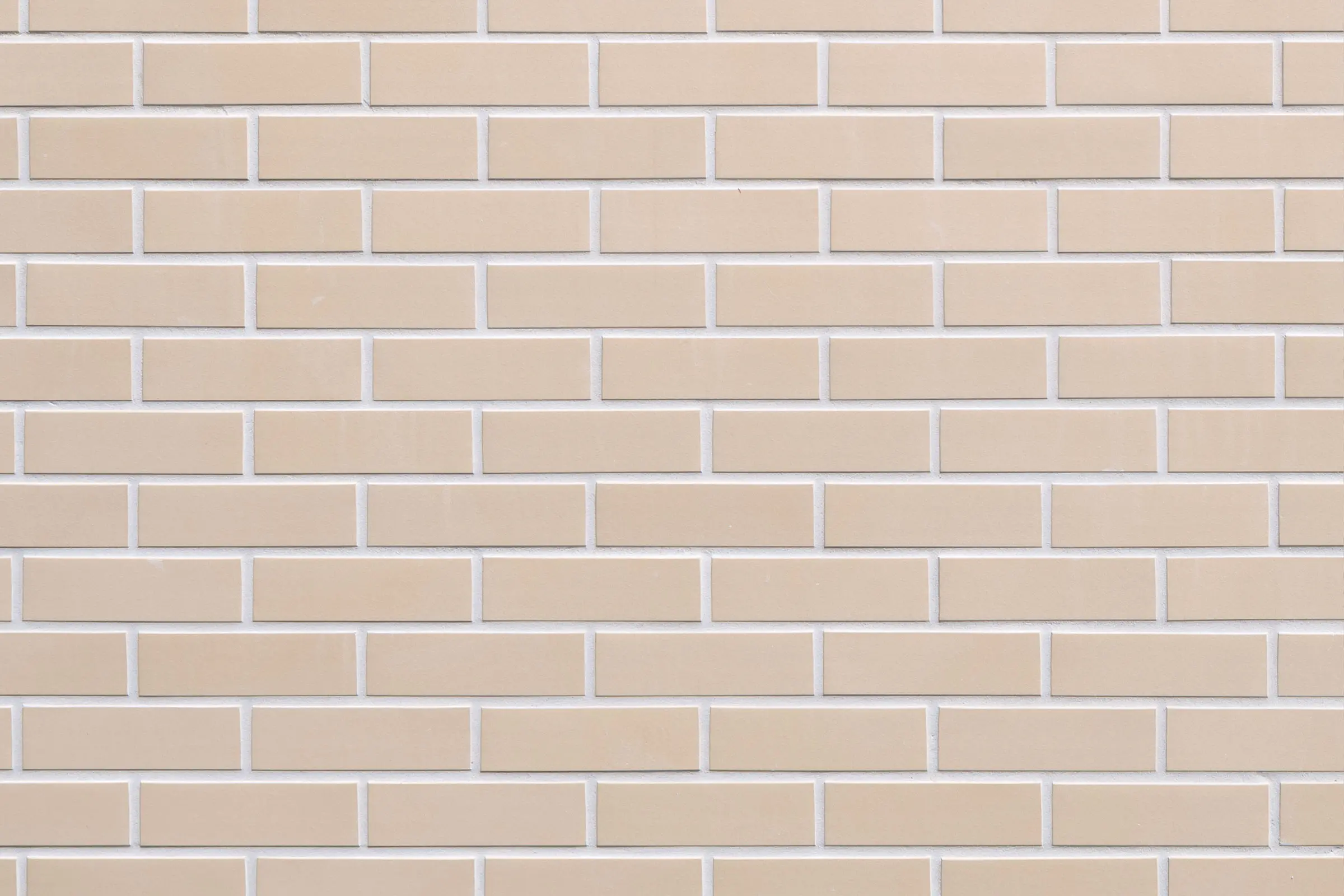 Digital close-up of StoBrick facade cladding, light beige bricks